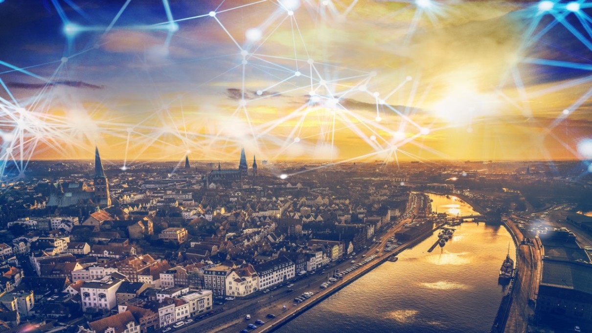 Die Hansestadt Lübeck aus der Vogelperspektive mit grafischen Datennetzen am Himmel Die Hansestadt Lübeck aus der Vogelperspektive mit grafischen Datennetzen am Himmel